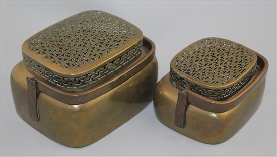 Two Chinese bronze hand warmers, 18th / 19th century, 17cm and 20.5cm, repair to smaller cover